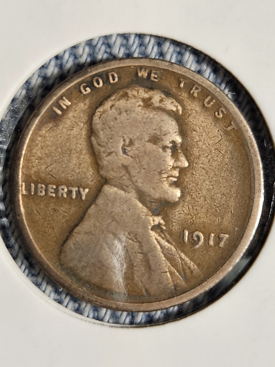 1917 Lincoln Wheat Penny off-center strike showing crescent of blank planchet and shifted design